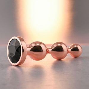 Gender X Gold Digger - Small Rose Gold Butt Plug with Black Gem Base