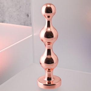 Gender X Gold Digger - Medium Rose Gold Butt Plug with Black Gem Base