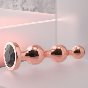 Gender X Gold Digger - Medium Rose Gold Butt Plug with Black Gem Base